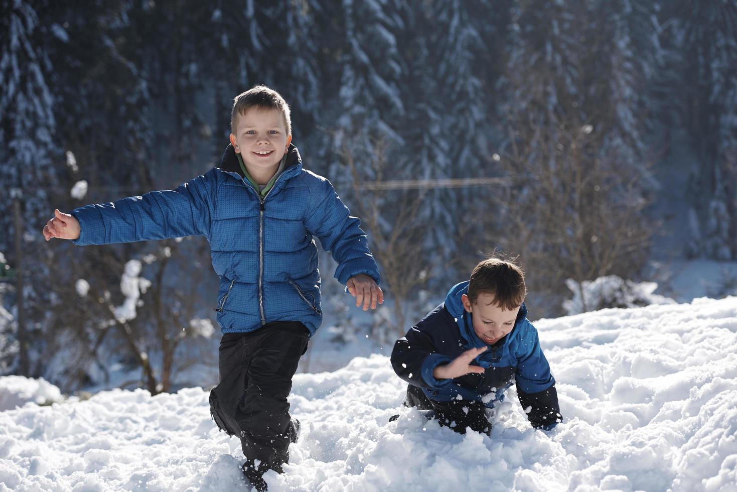 kids playing with  fresh snow photo