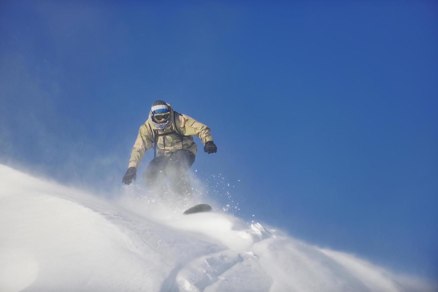 freestyle snowboarder jump and ride photo