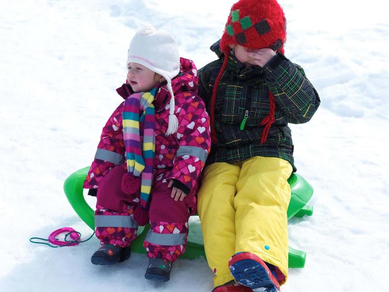 portrait of boy and baby girl on winter vacation photo