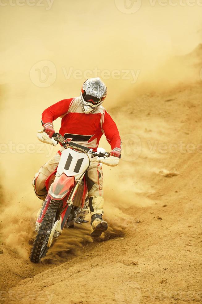 Riding a motocross bike photo