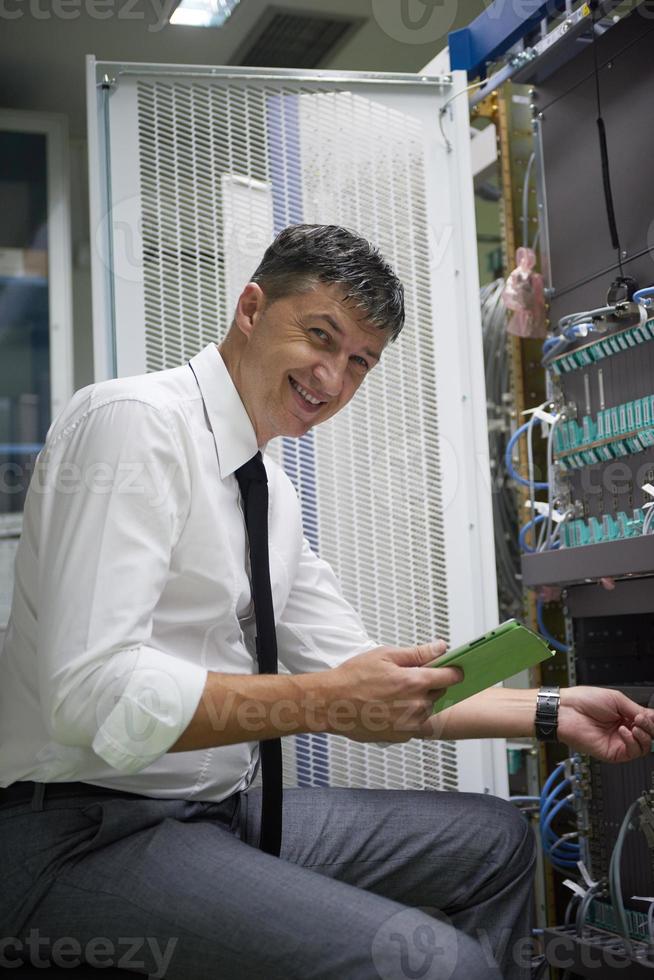 network engineer working in  server room photo