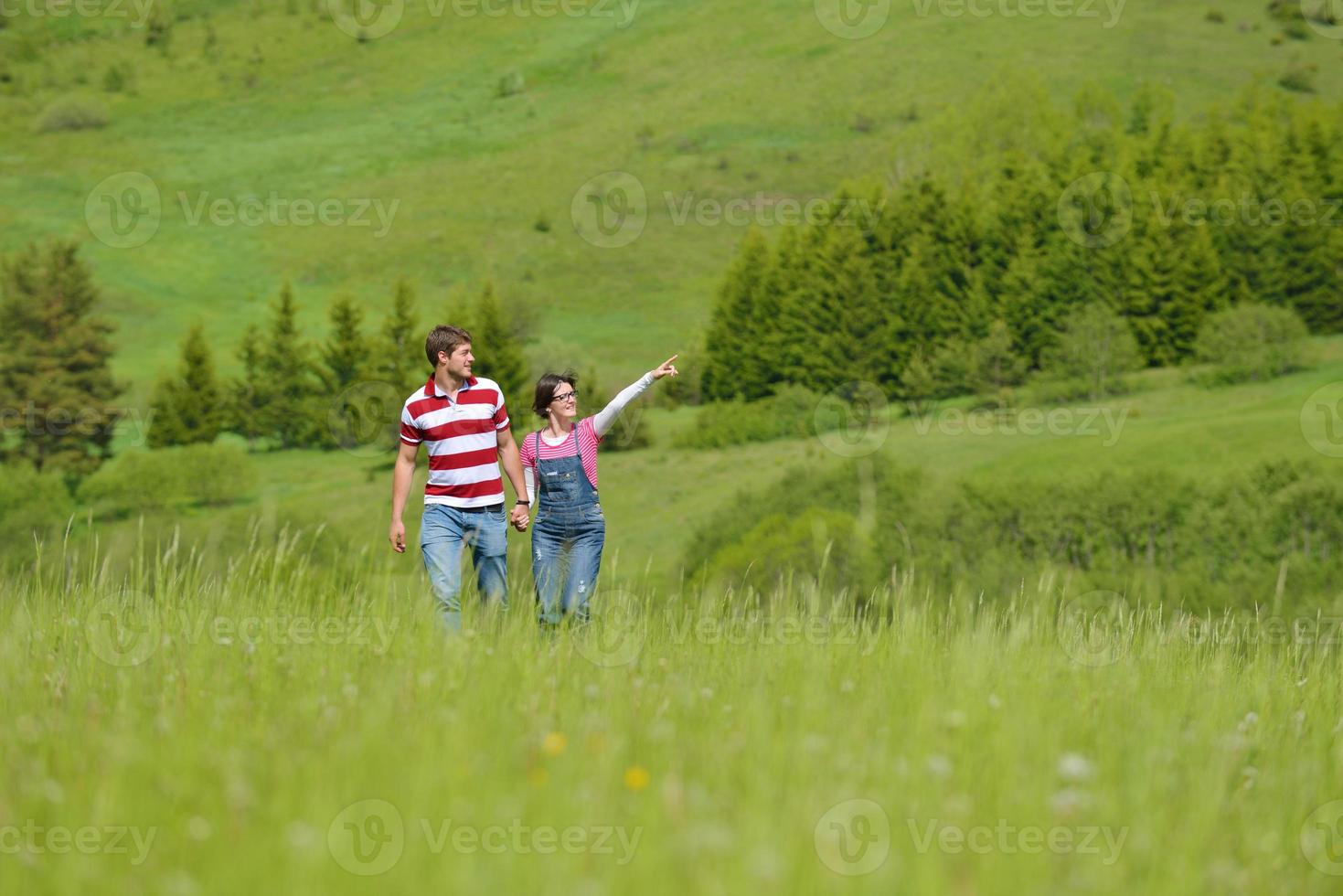 Portrait of romantic young couple smiling together outdoor photo