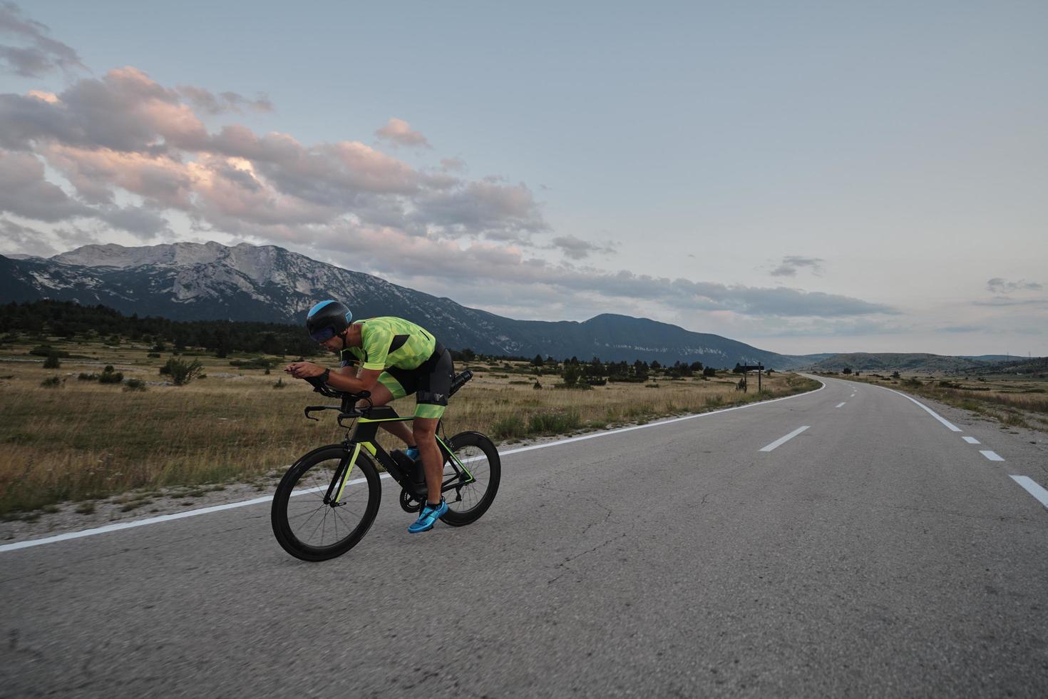 triathlon athlete riding bike photo