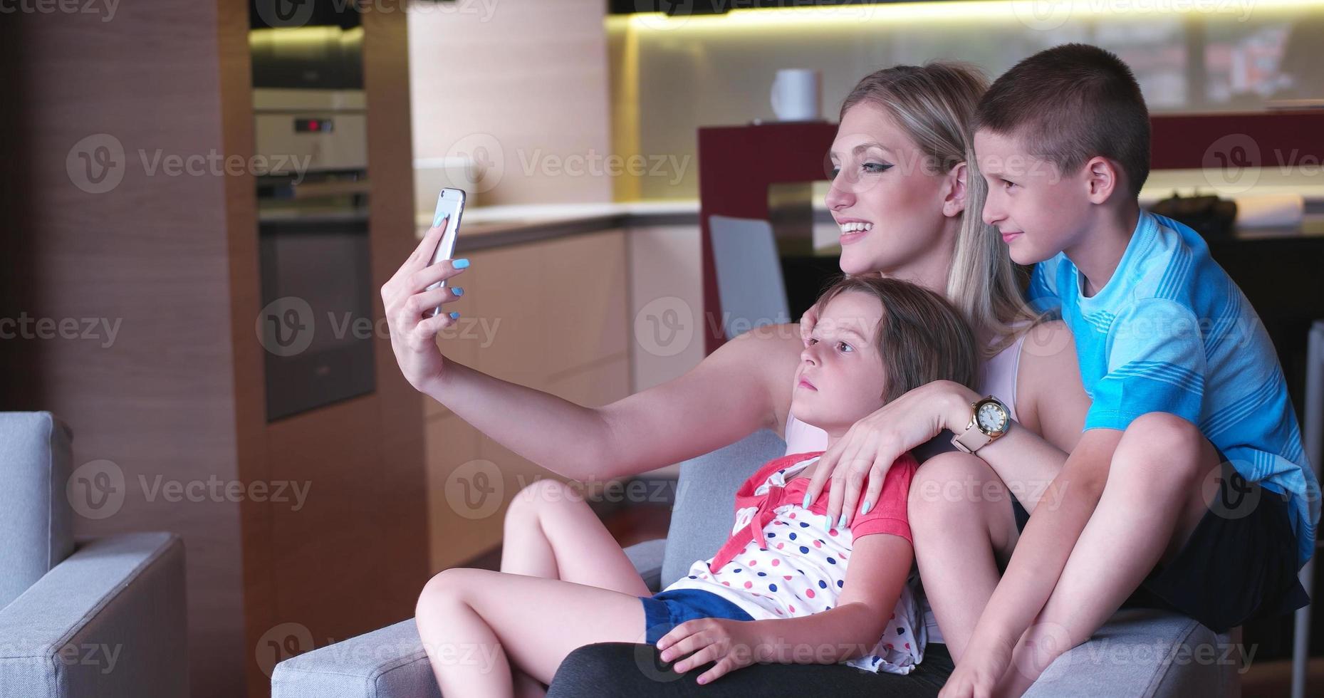 Family relaxing in living room photo