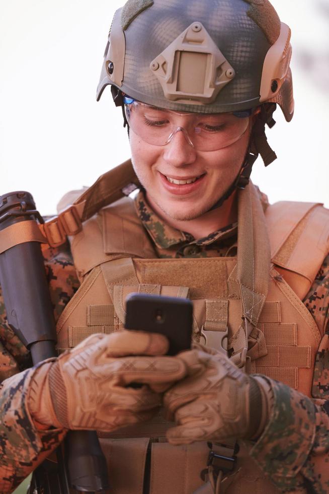 soldier using smart phone photo