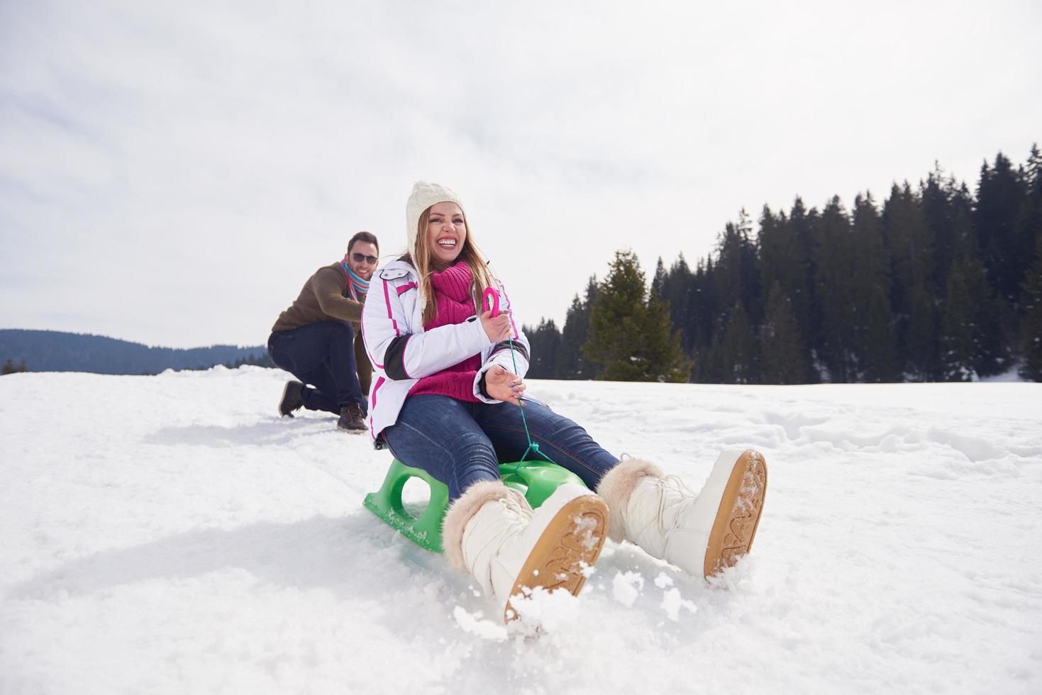 happy young couple having fun on fresh show on winter vacation photo