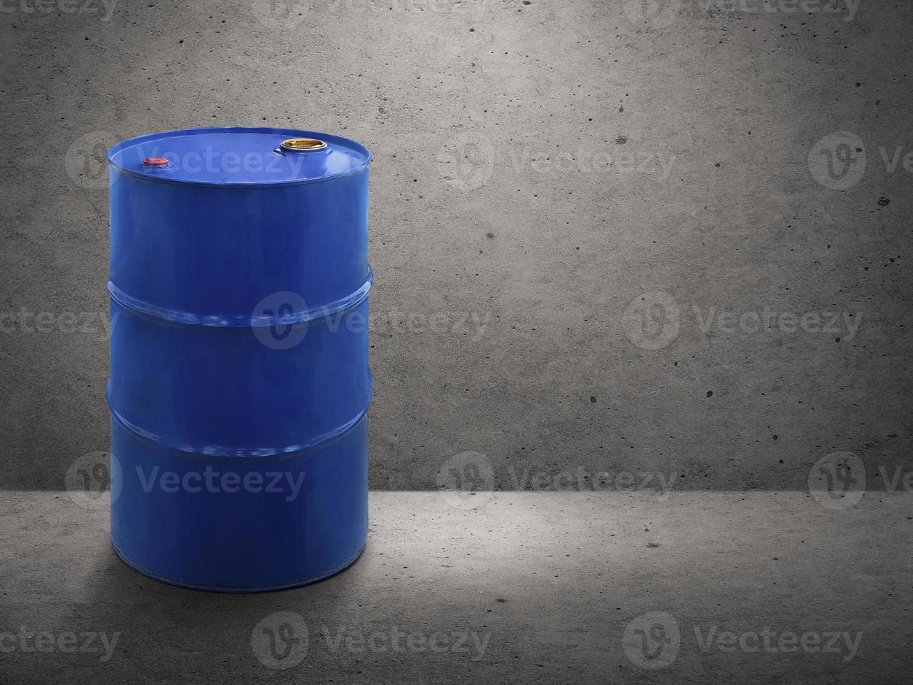 Blue oil tank on cement wall background photo