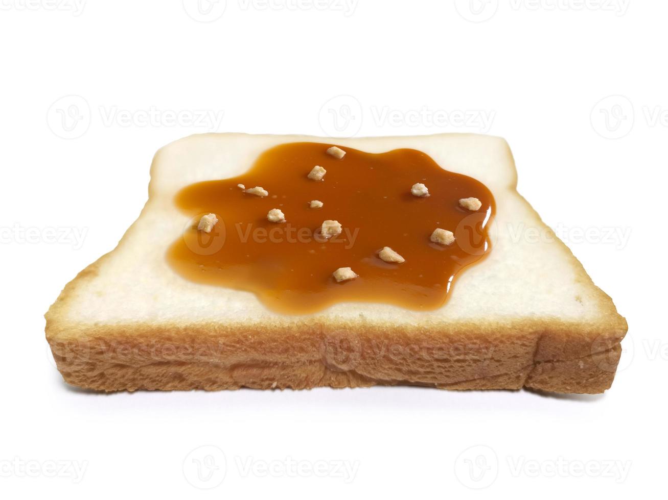 Almond Nuts and caramel sauce nuts on sliced bread on white background photo