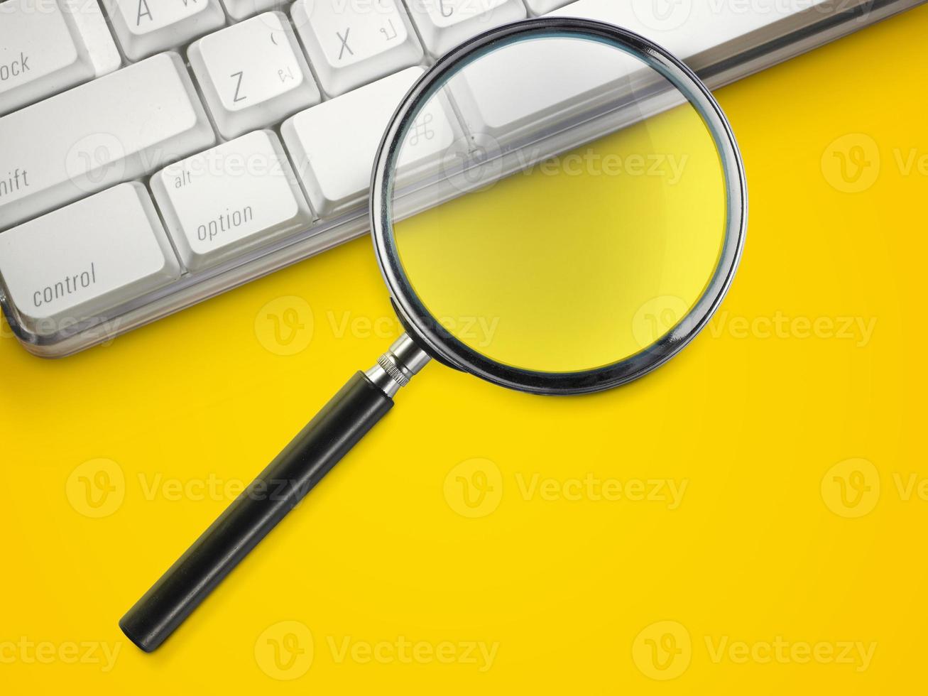 laptop computer with magnifying glass search concept photo