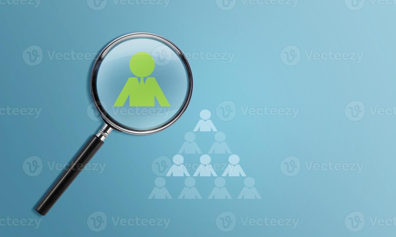 HRM or Human Resource Management, Magnifier glass focus to manager icon which is among staff icons for human development recruitment leadership and customer target group concept photo