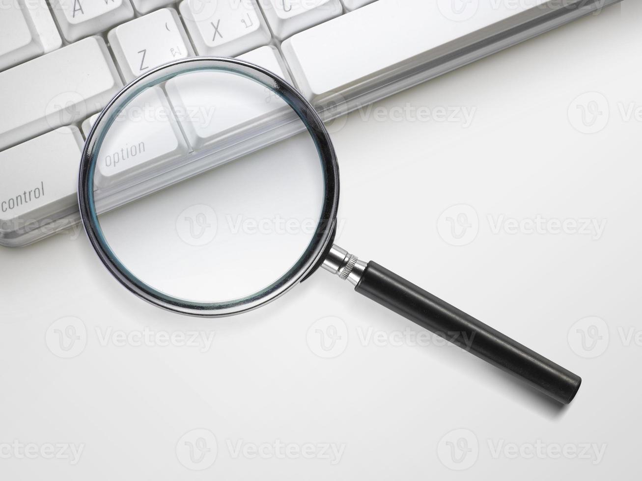 laptop computer with magnifying glass search concept photo