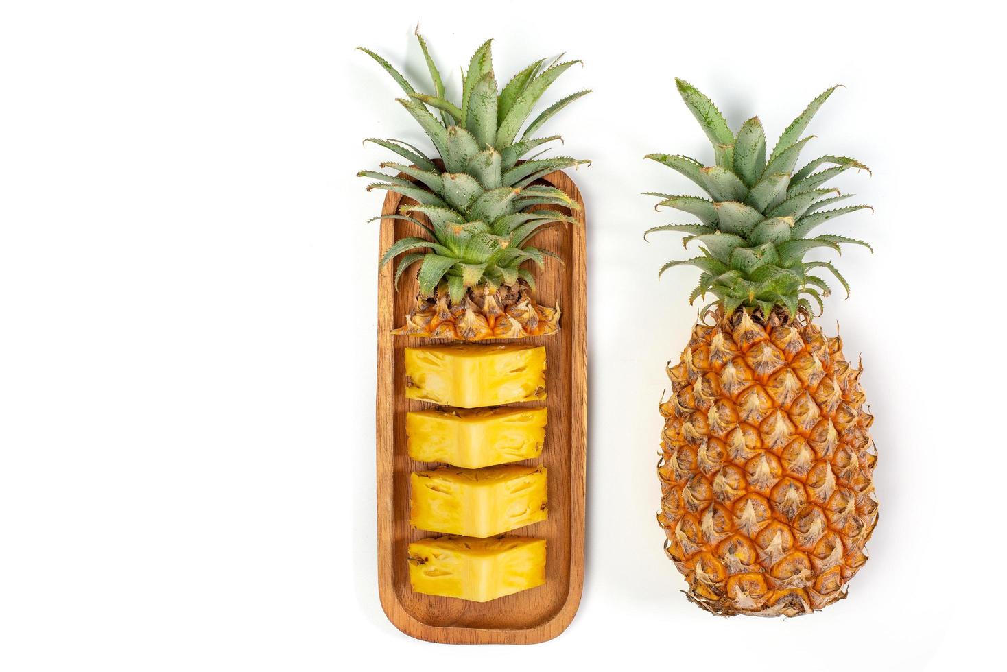 Pineapple slide on white background photo