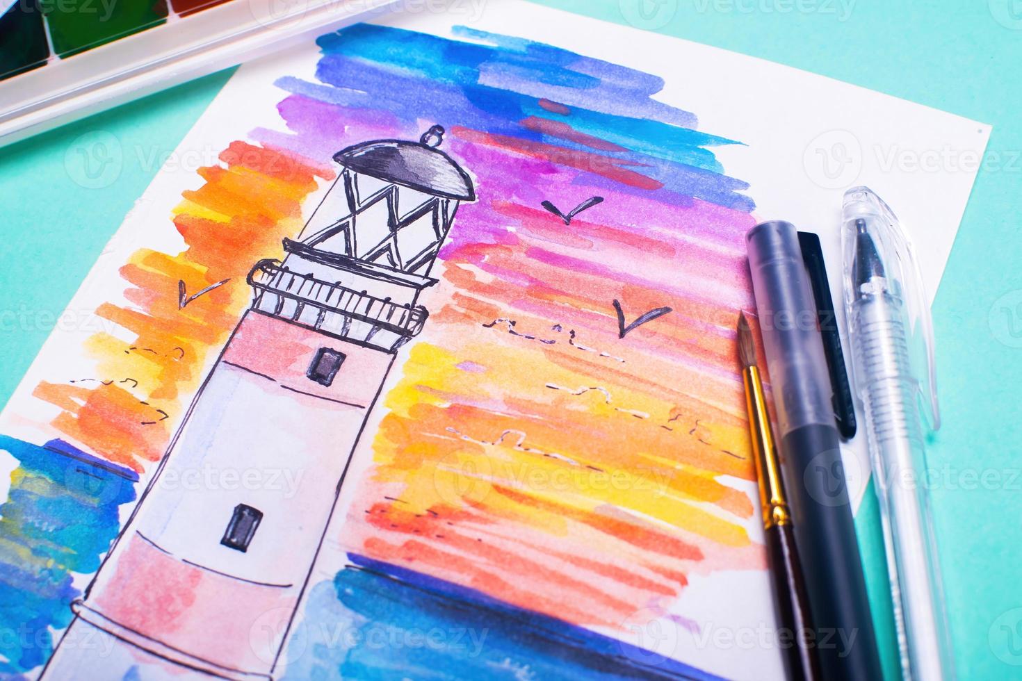 Lighthouse on coast of sea. Hand drawn beacon. Sketch with paints and pens on the table. photo