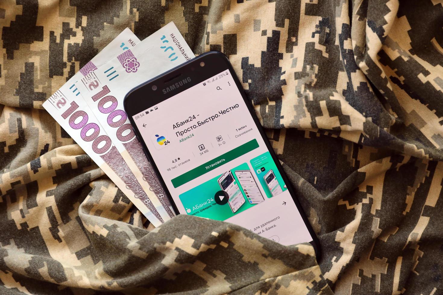 Ternopil, Ukraine - April 24, 2022 A-Bank banking app on smartphone screen. A-Bank is important commercial bank in Ukraine photo