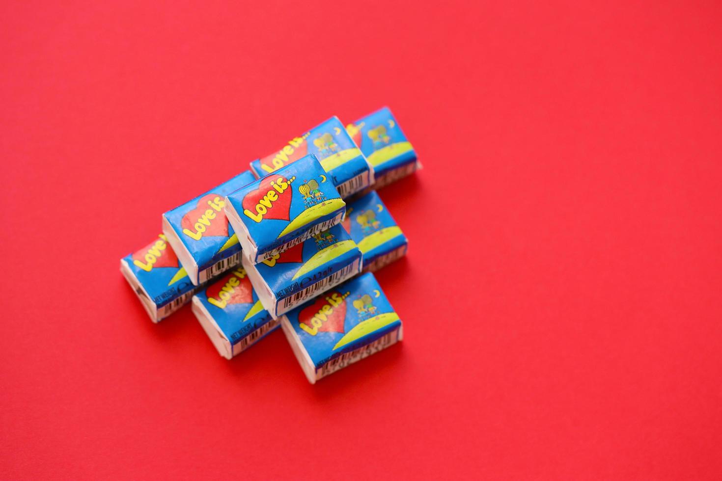 Ternopil, Ukraine - May 8, 2022 Love is - turkish bubble gums from 1990s popular in russian region. Various flavors of Love is chewing gum with liners about love photo