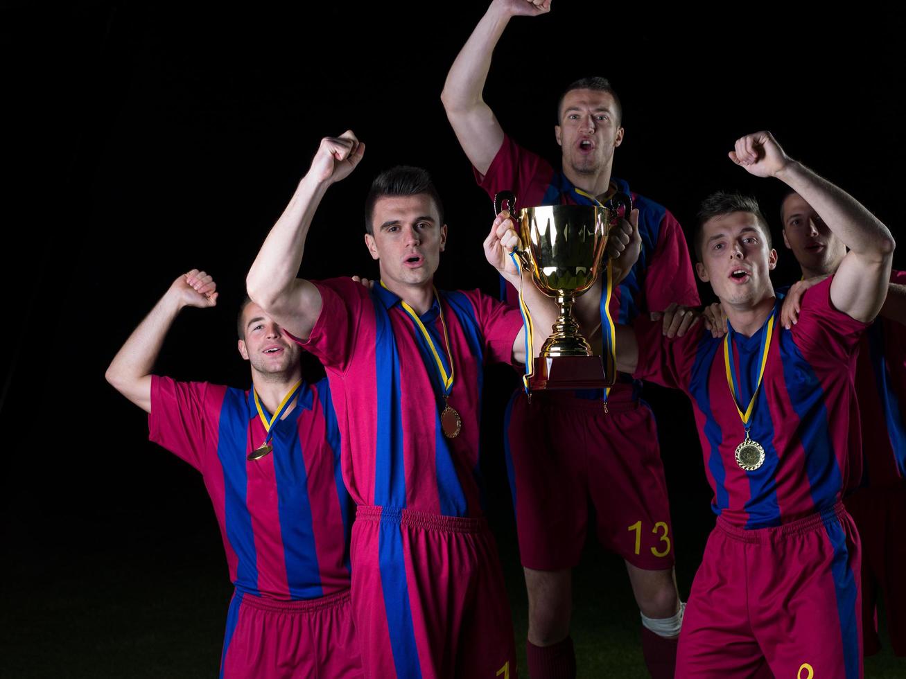 soccer players celebrating victory photo