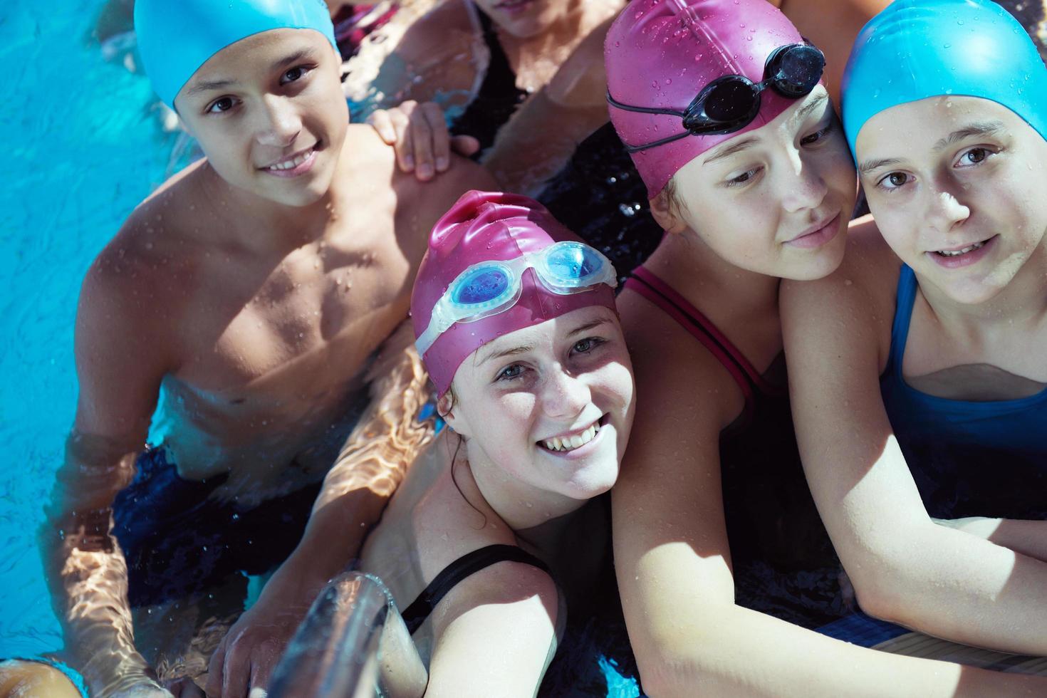 happy children group  at swimming pool photo