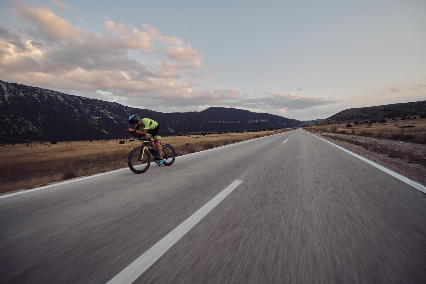 triathlon athlete riding bike photo