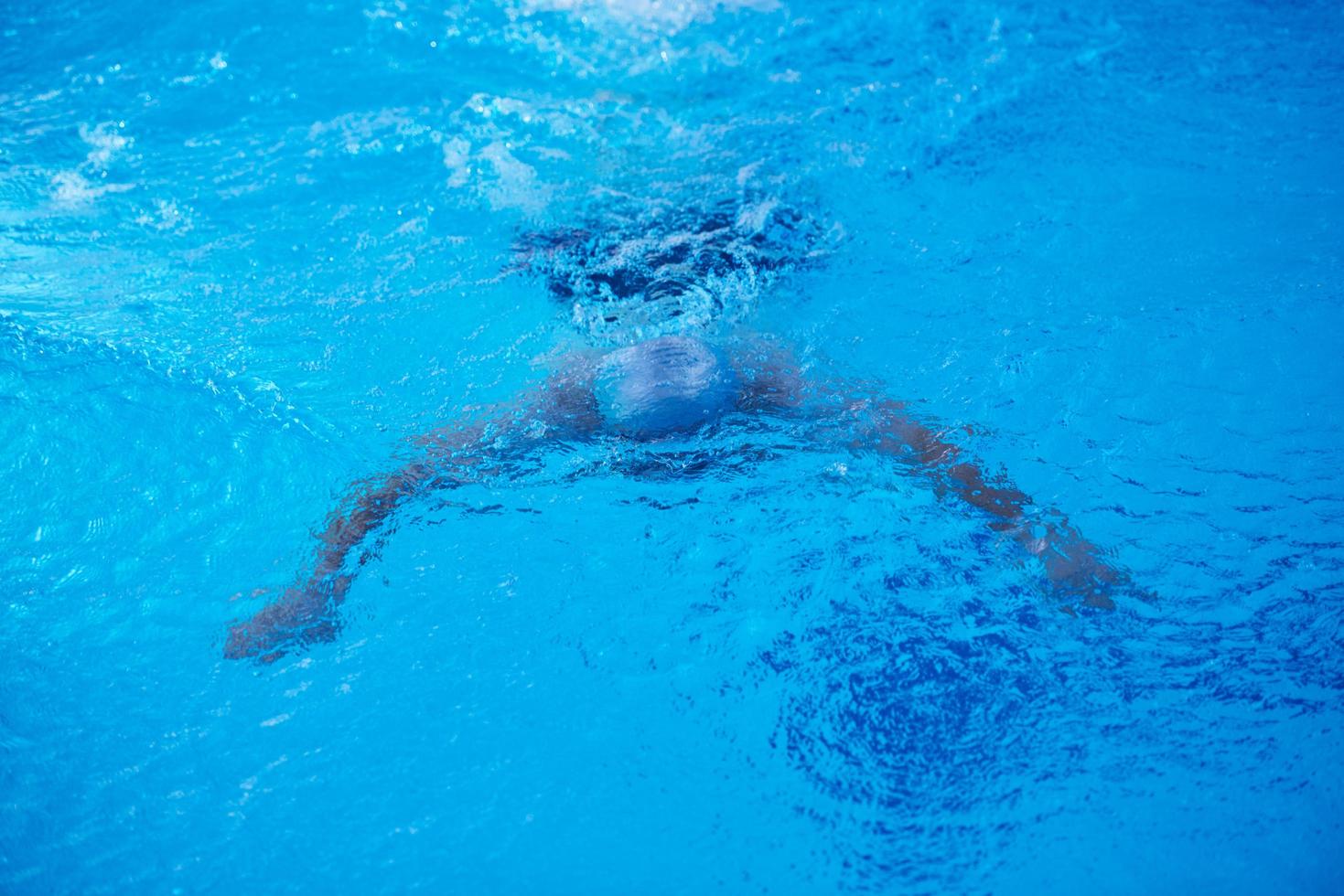 swimmer excercise on indoor swimming poo photo