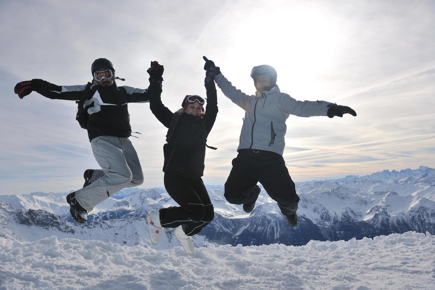 people group on snow at winter season photo