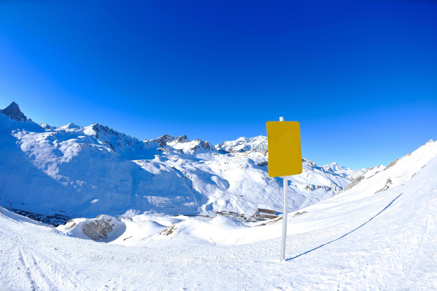 Sign board at High mountains under snow in the winter photo