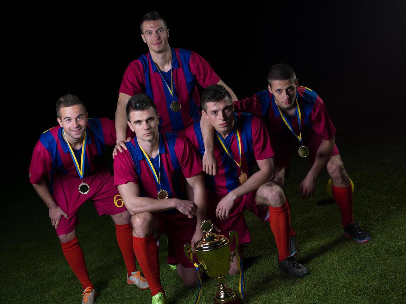 soccer players celebrating victory photo