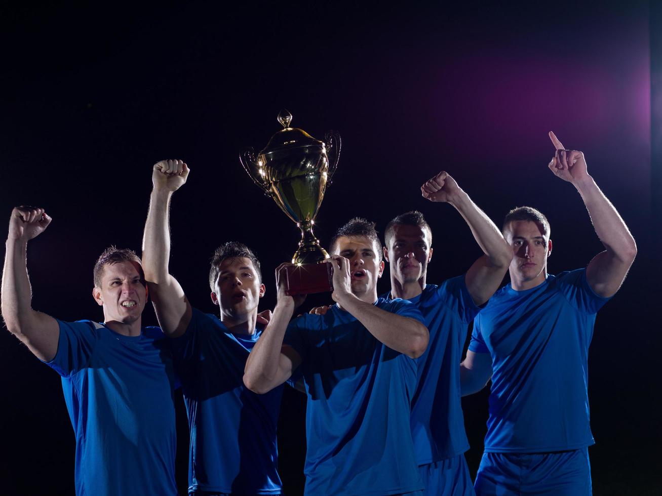 soccer players celebrating victory photo