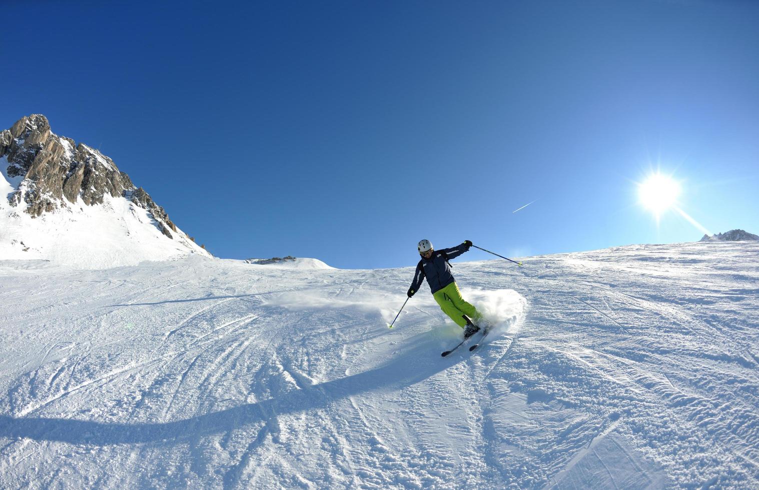 skiing on fresh snow at winter season at beautiful sunny day 11630562
