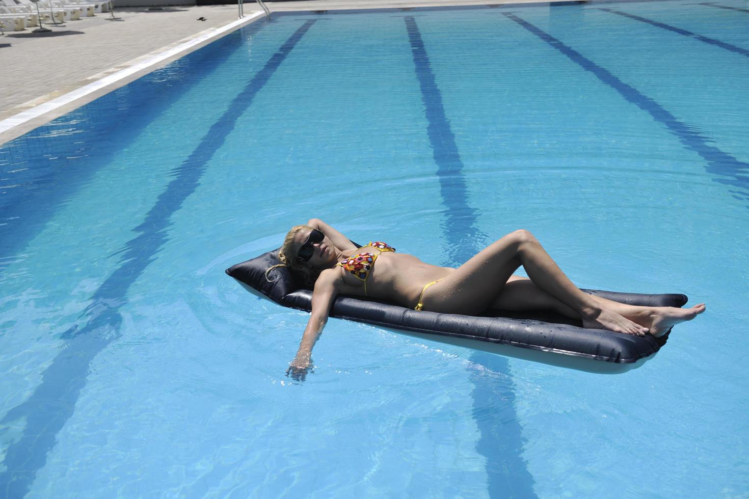 beautiful woman relax on swimming pool photo