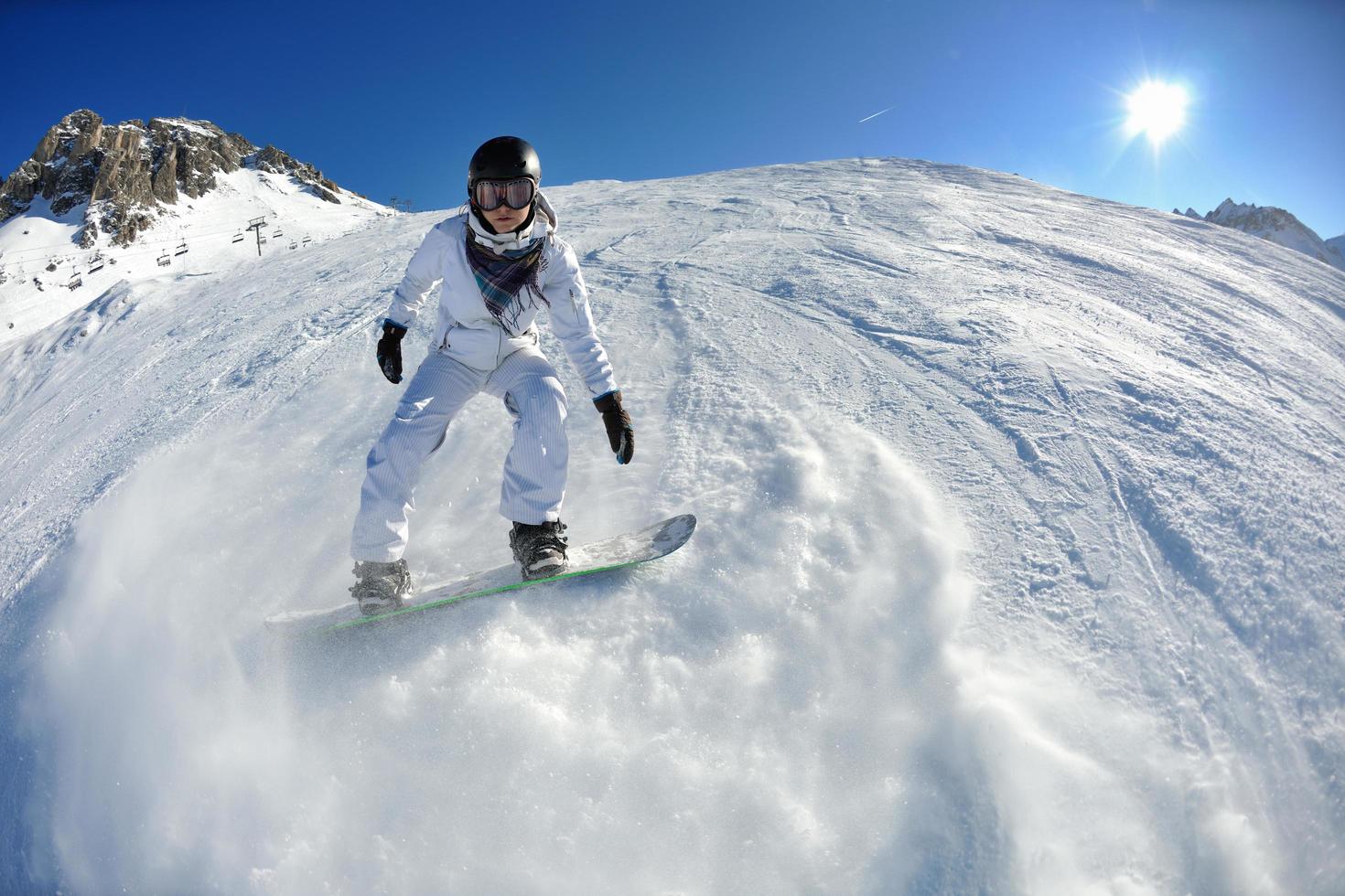 skiing on fresh snow at winter season at beautiful sunny day photo