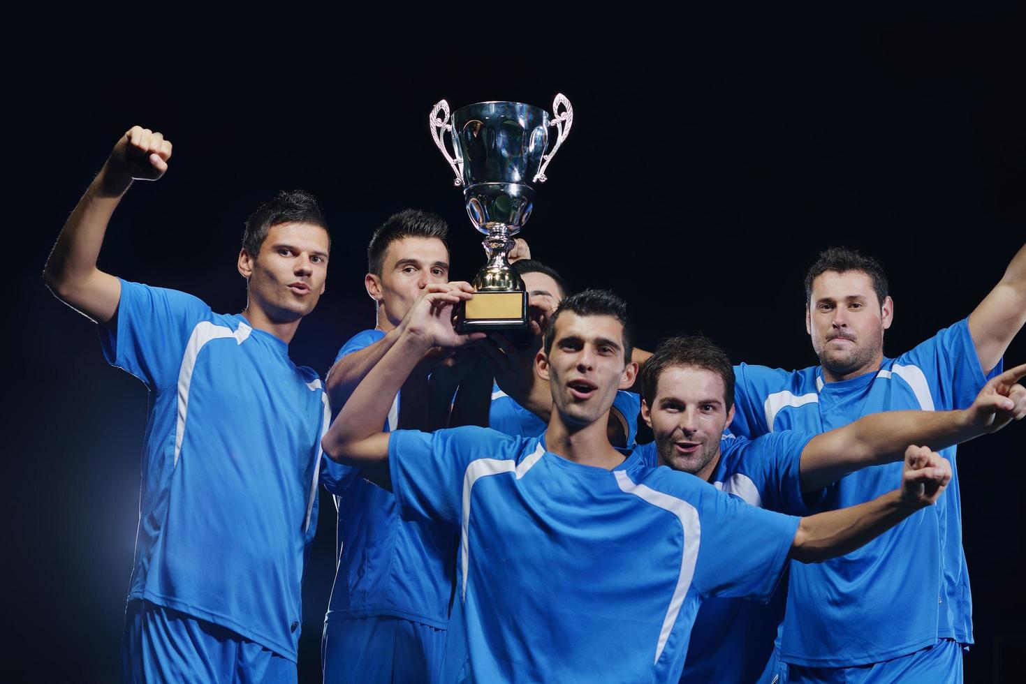 soccer players celebrating victory photo