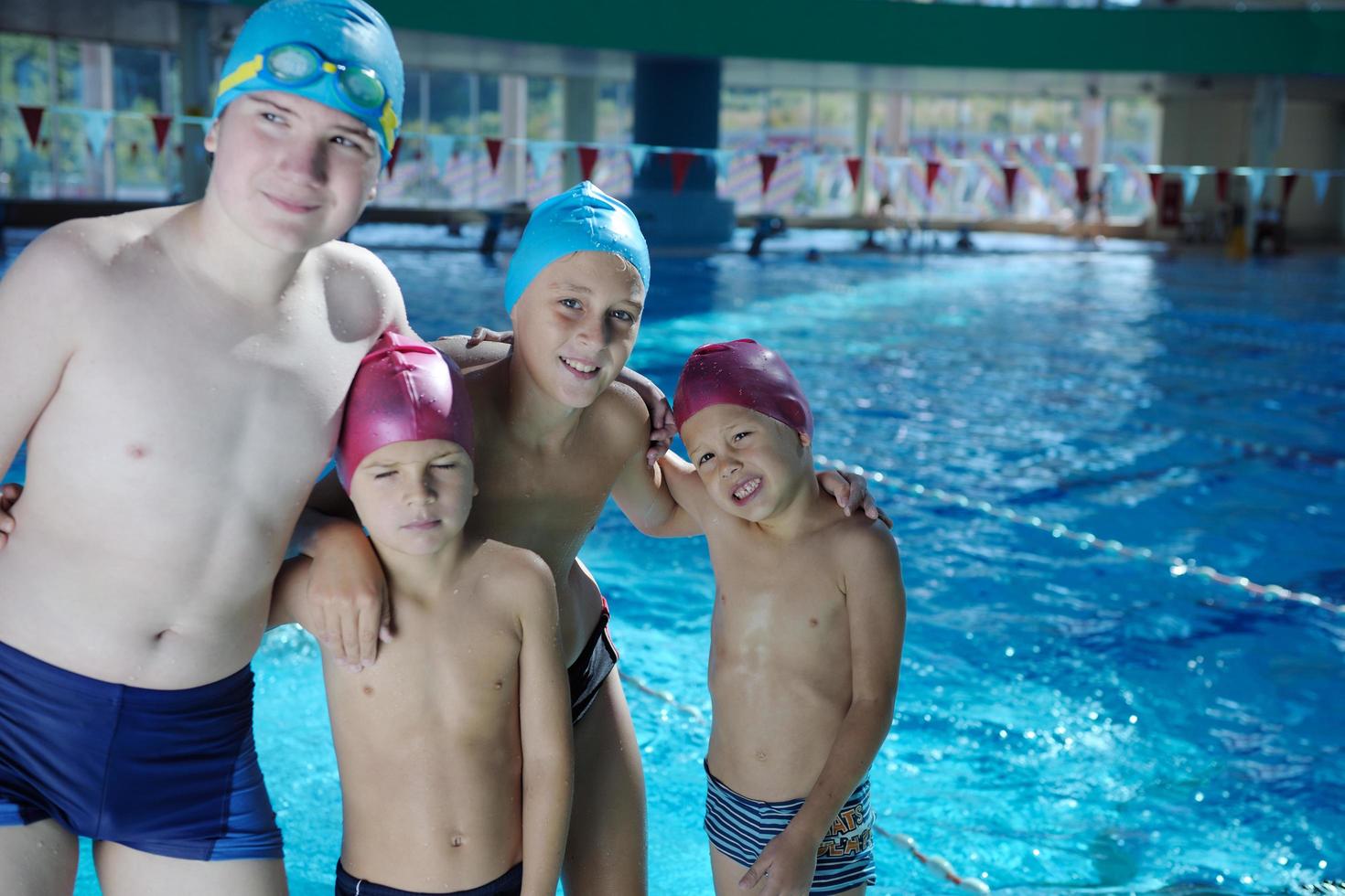 happy childrens at swimming pool photo