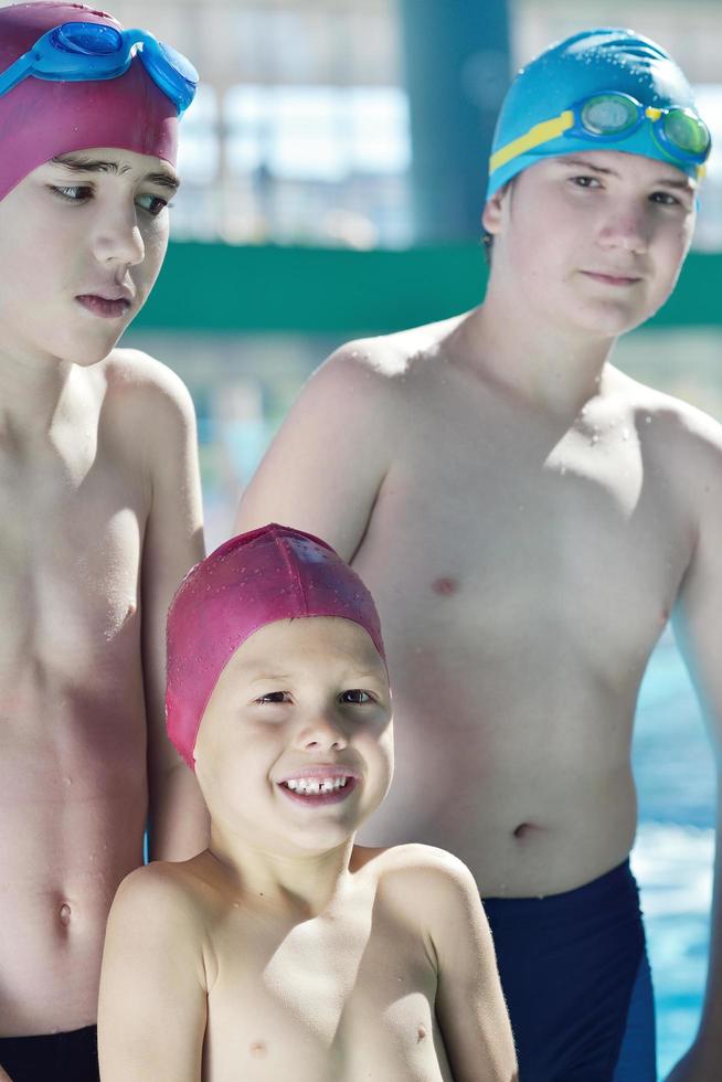 happy children group  at swimming pool photo