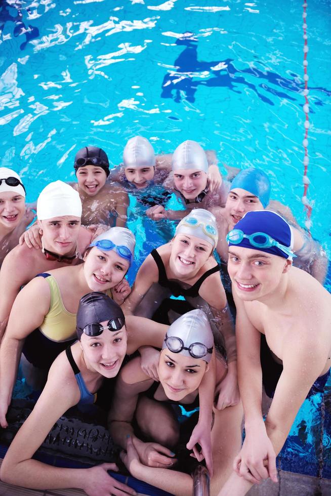 happy teen group  at swimming pool photo