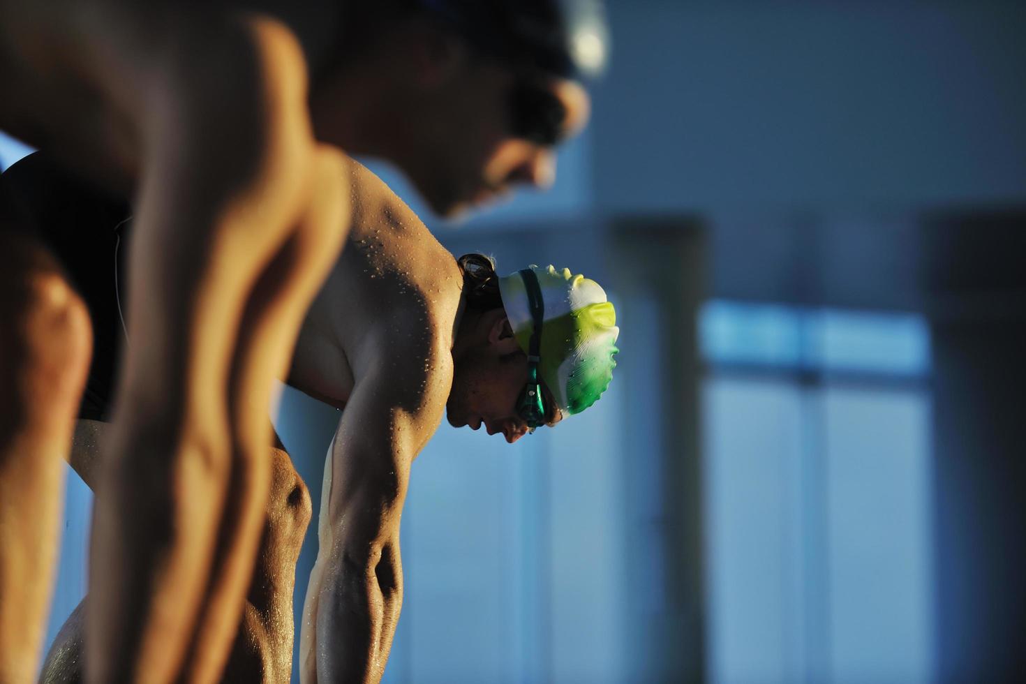 young swimmmer on swimming start photo