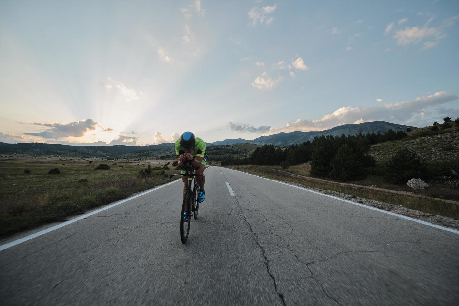 triathlon athlete riding bike photo