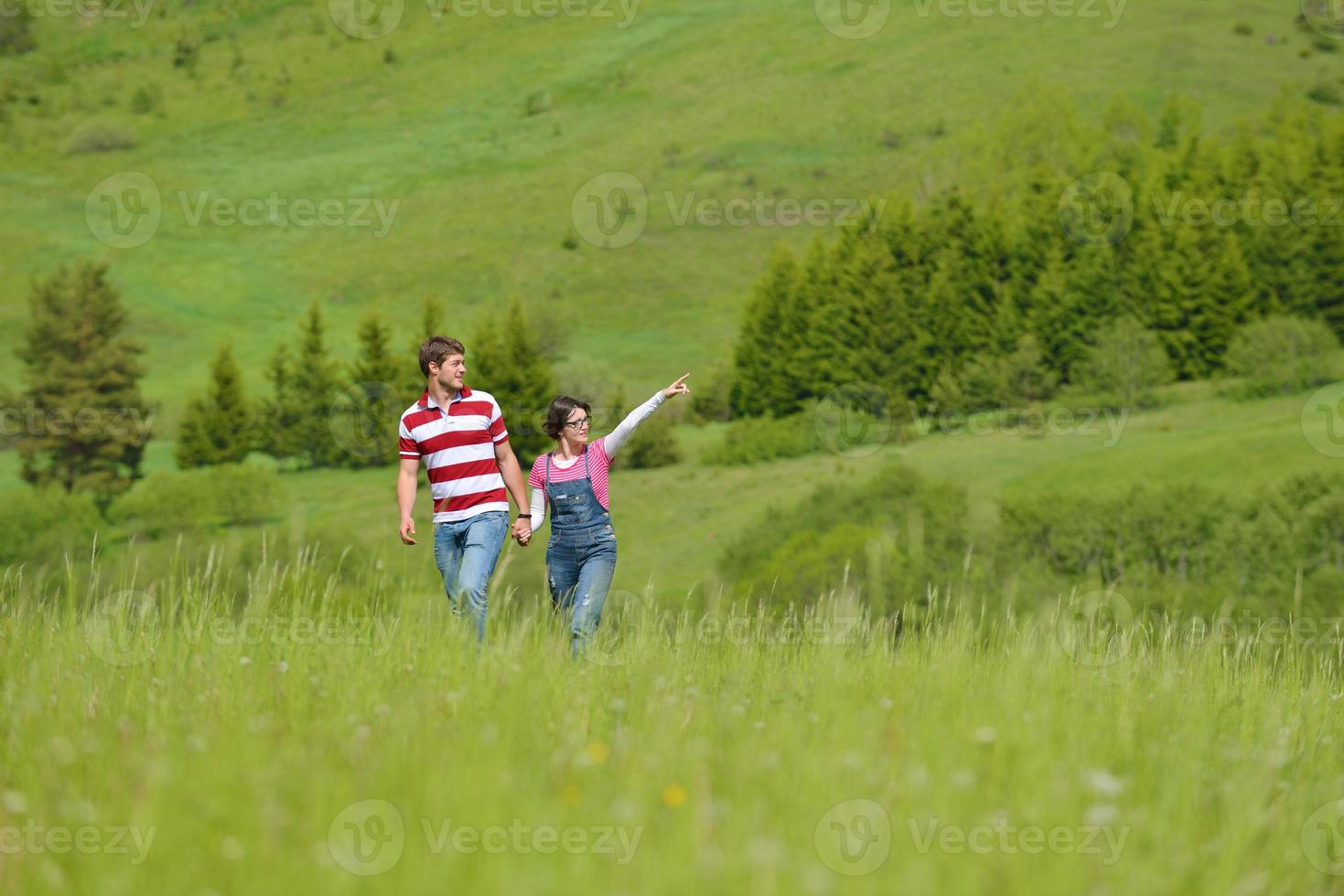 Portrait of romantic young couple smiling together outdoor photo