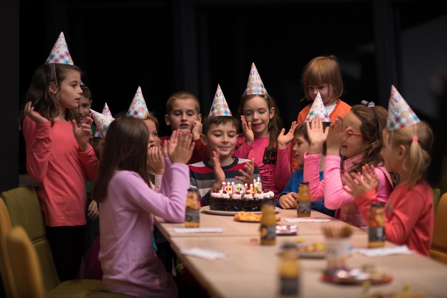 The young boy joyfully celebrating his birthday photo