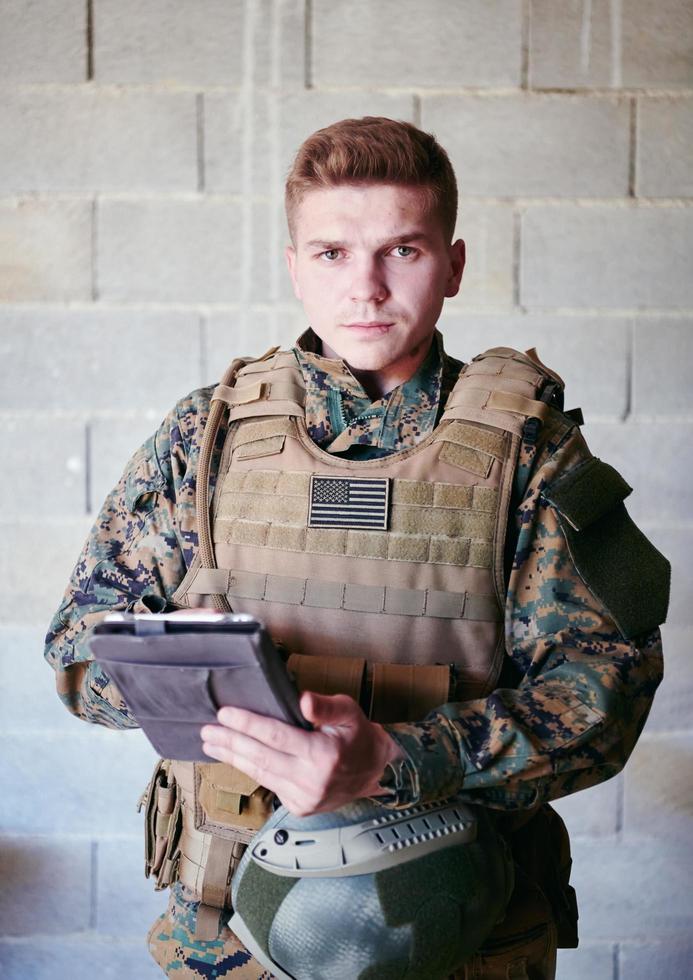 soldier using tablet computer photo