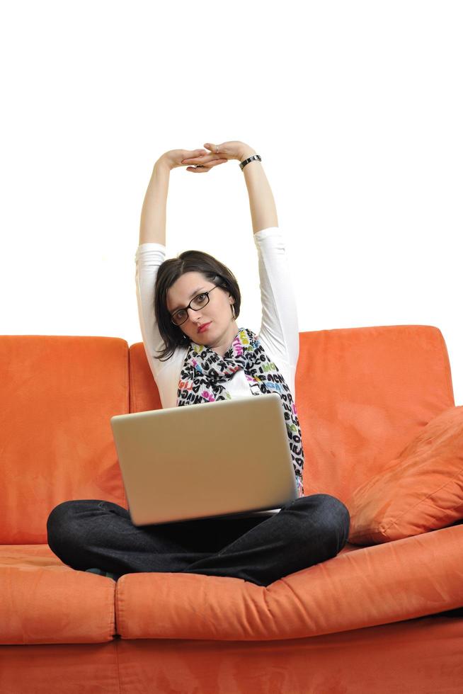 woman using a laptop computer at home photo