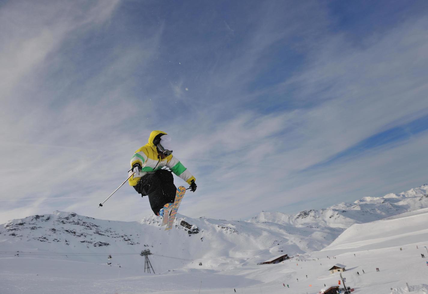 happy young man have fun at winter on mountain peak photo