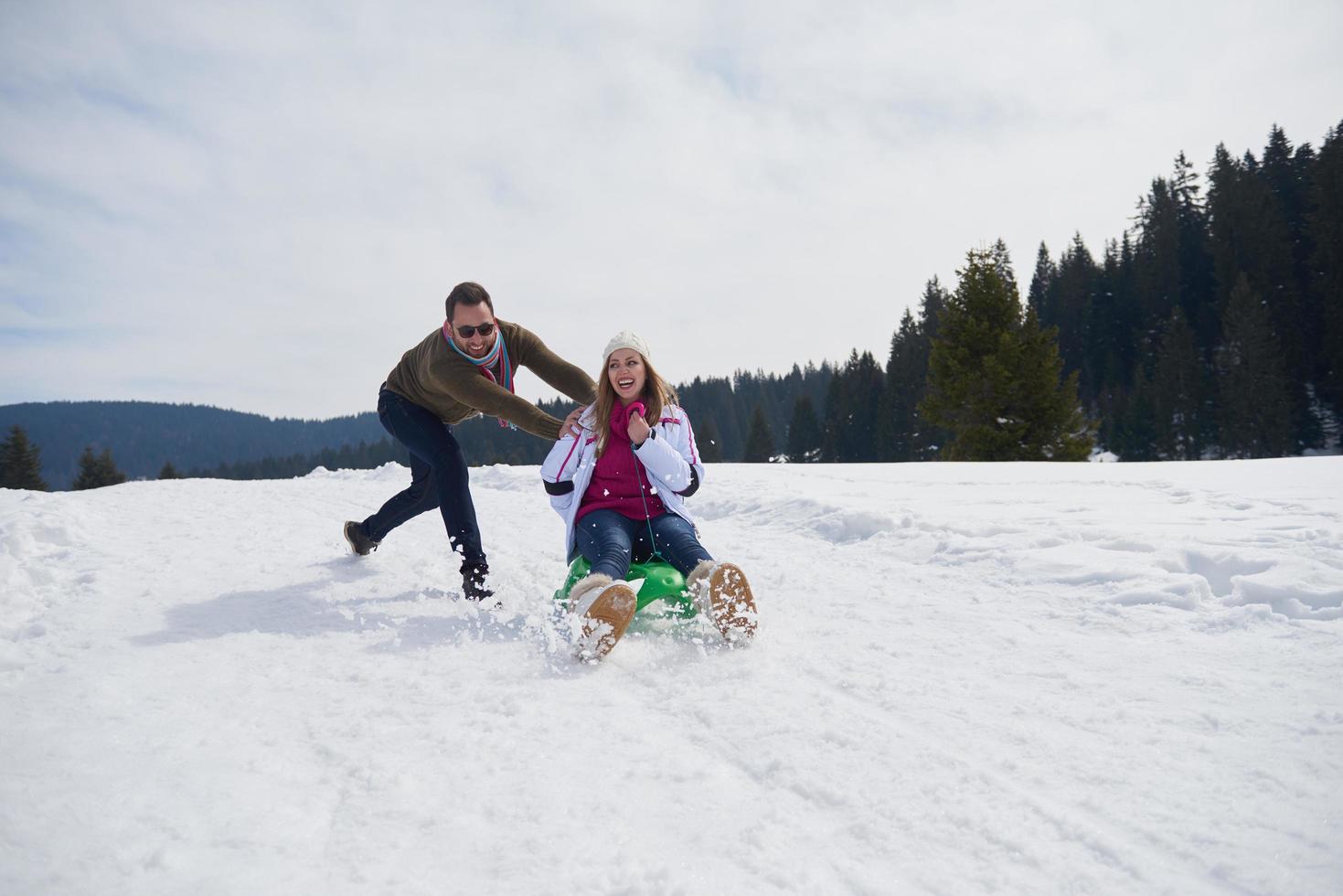 happy young couple having fun on fresh show on winter vacation photo