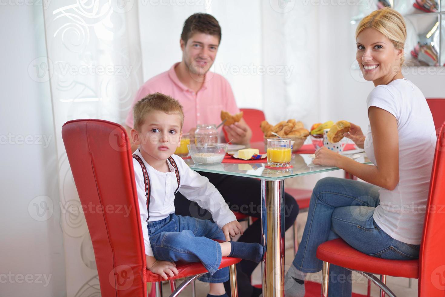 family have healthy breakfast at home photo