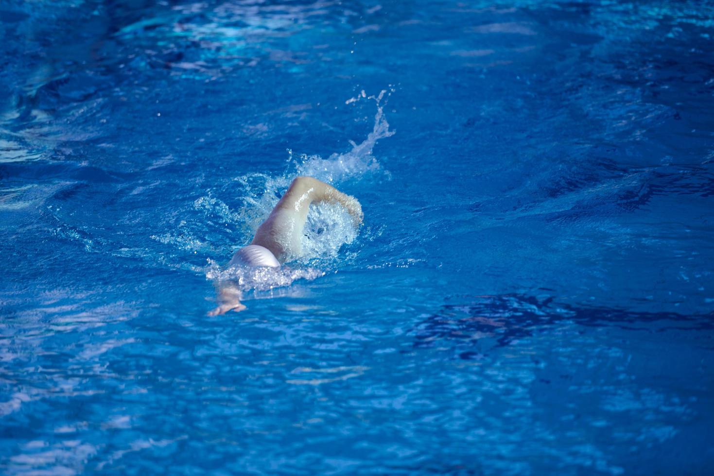 swimmer excercise on indoor swimming poo photo