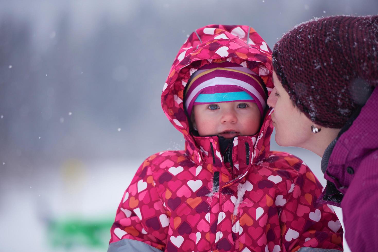 Family in winter landscape photo