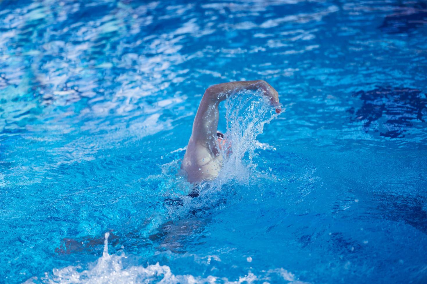 swimmer excercise on indoor swimming poo photo