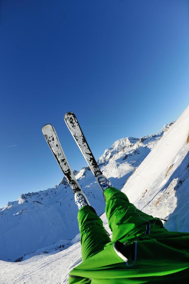 skiing on fresh snow at winter season at beautiful sunny day photo