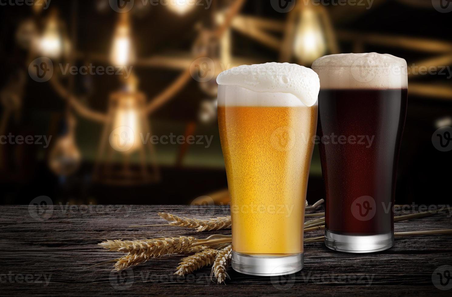 Glasses of Light Beer and Dark Beer with wheat on the bar counter in the restaurant at night, with copy space photo