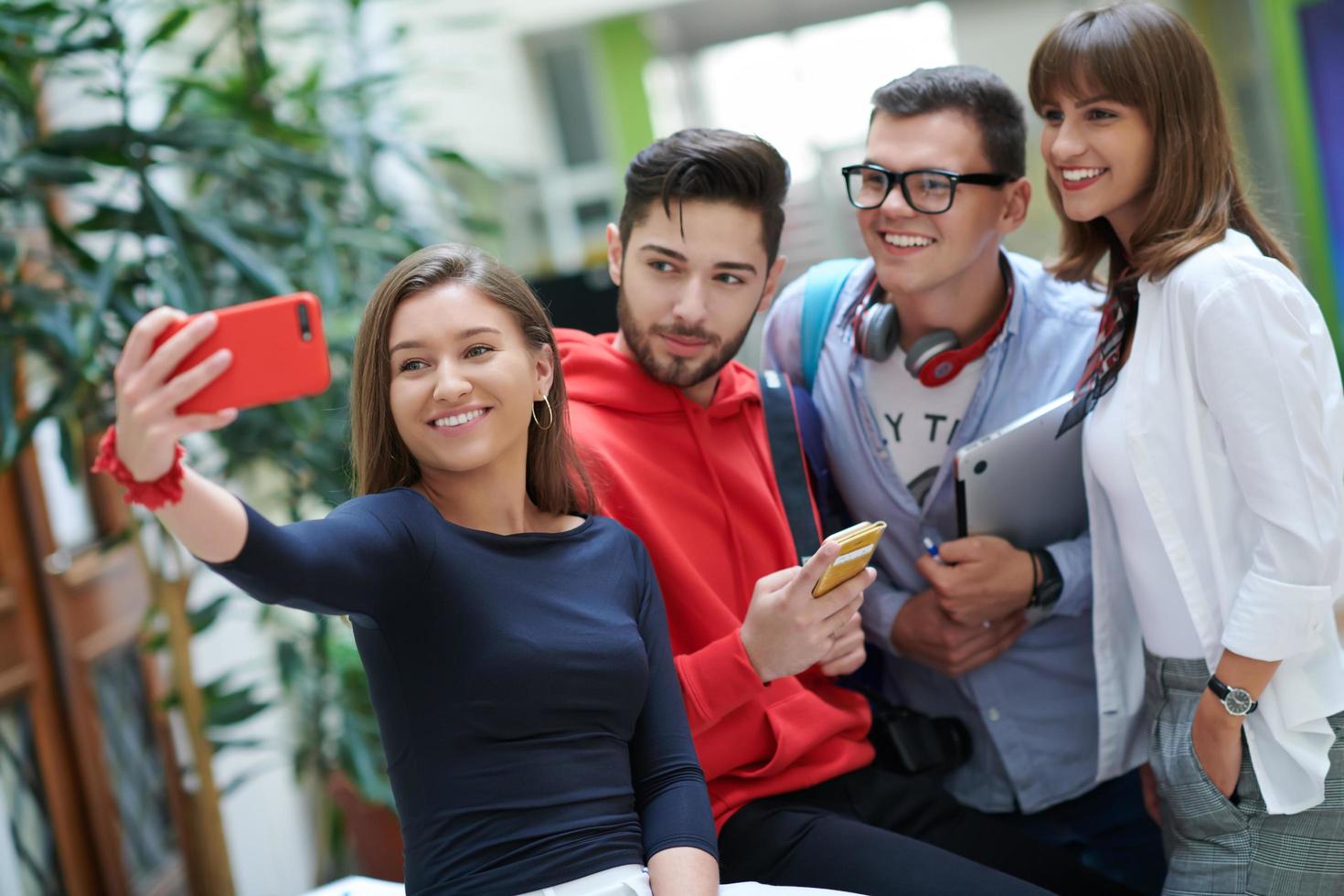 Group of multiethnic teenagers taking a selfie in school photo