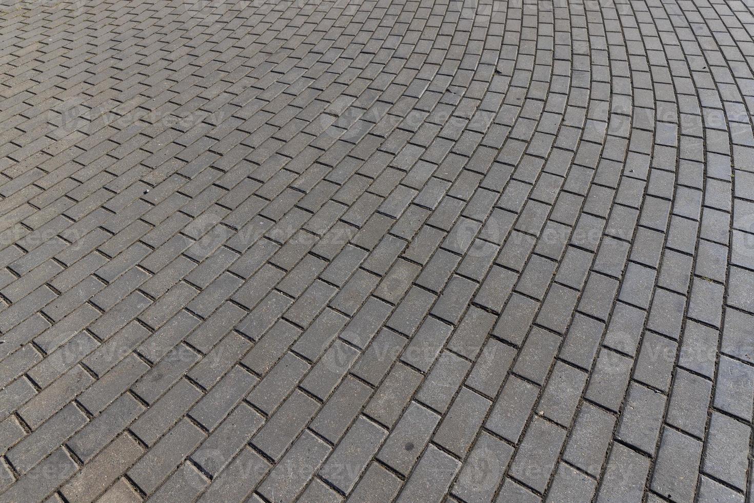 part of the road made of concrete tiles photo